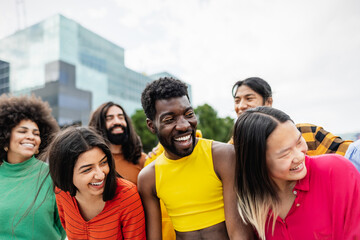 Wall Mural - Young multiracial friends having fun together hanging out in the city - Friendship and diversity concept