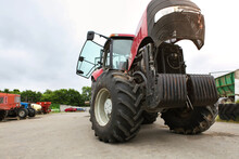 Agricultural Machinery Repair, Open Tractor Hood, Modern Engine, Tractor Maintenance.