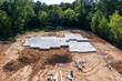 © Chad Robertson - New Home construction site with concrete foundation