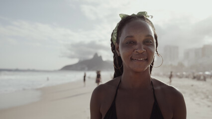 Latin young girl, famous beach Rio de Janeiro, Brazil. Latin summer vacation holiday.