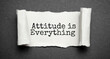 Attitude Is Everything text torn on the dark background
