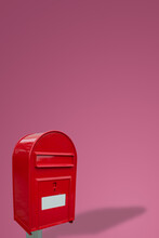 Cover Page With Big Fancy Red Metal Postbox With White Empty Note Space For Address Isolated At Pink Gradient Background With Copy Space. Concept Of Communication And Post Service.