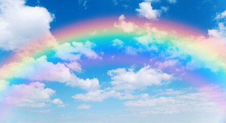Wall Mural - sunny day background with rainbow, blue sky with white cumulus clouds, natural summer or spring back