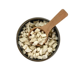 Wall Mural - Pile of dried and sliced marshmallow root (Althaea officinalis) in a bowl with wooden spoon isolated on white background