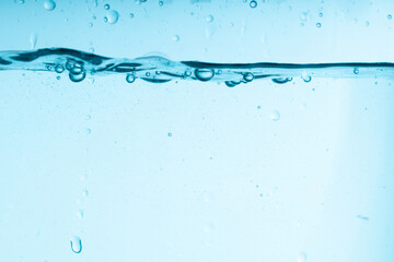 Poster - blue splash of water in a glass vessel