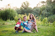 © AS Photo Family - Happy young family: mother, father, two children son on nature having fun.
