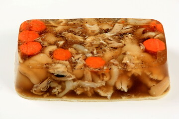 Wall Mural - jellied meat pieces on white background. Jelly with meat, pork aspic, traditional russian dish. meat aspic on white