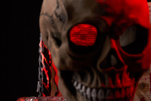Close-up Creepy Humans Skull With Red Lighting On Black Background. Isolated On Black Background.