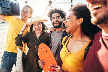 Wall Mural - Multicultural happy friends enjoying music festival summer party - Group of young people having fun together hanging outside on a sunny day - Youth lifestyle and summertime holidays concept