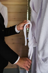 Adult chambermaid and hotel manager cleaning the room