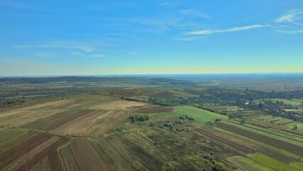 Wall Mural - Aerial view of green countryside in view of summer agricultural fields