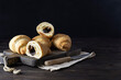 © Анна Никитина - Crispy croissants with chocolate on a wooden plank. Knife on a light napkin. Dark background, space for text