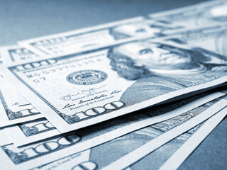 Wall Mural - american paper money. several one hundred dollar banknotes lie on textured surface. focus on the num