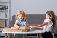 Kids Open Pizza Box At Home. Children Preparing To Eat Pizza.