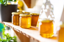 Natural Honey In Various Jars On A Wooden Shelf, Souvenir Village Market.