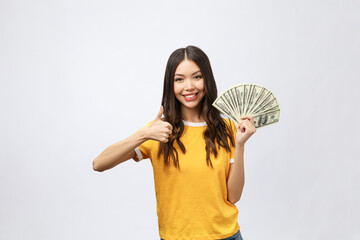 Wall Mural - Closeup portrait of beautiful asian woman holding money isolated on white background. Asian girl counting her salary dollar note. Success wealth financial business cashflow currency payment concept