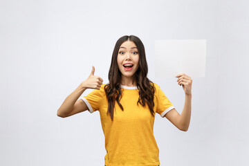 Canvas Print - Excited woman thumbs up with blank poster sign. Young woman mixed asian caucasian ethnicity.