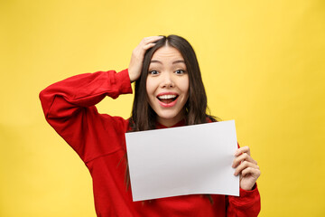 Canvas Print - girl holds a white sheet in hands, an office worker shows a blank sheet.