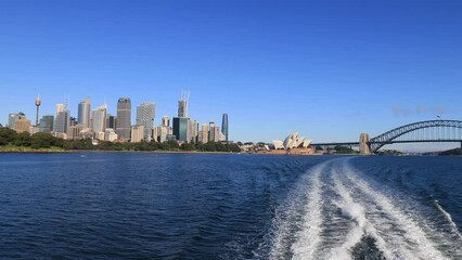 Canvas Print - ferry water trail on Sydney harbour departing city CBD waterfront to Manly 4k.
