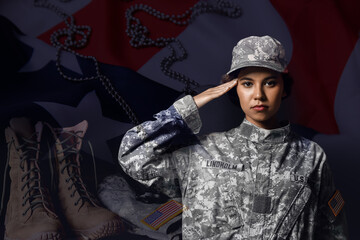 Wall Mural - Saluting African-American female soldier on dark background