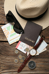 Sticker - Guide's accessories with passport, ticket and money on dark wooden background