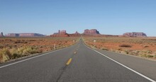 Monument Valley Road Traffic Desert Utah. Scenic Public Highway Through Southern Utah. Trail Of The Ancients. Navajo Nation Monument Valley Tribal Park From Public Highway.