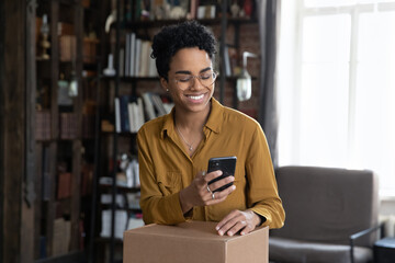 african woman client of easy trusted e-services online shipping, make order, use cellphone typing to