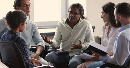 Poster - Indian man expert mentor consult diverse coworkers interns give professional advice help in developing business process. Attentive multiethnic students sit in circle listen to male teacher on seminar