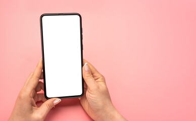 Woman hand using cellphone isolated on pink background. Female hands with cell phone. mobile phone blank white screen mockup. Shopping, delivery apps, social media applications ads