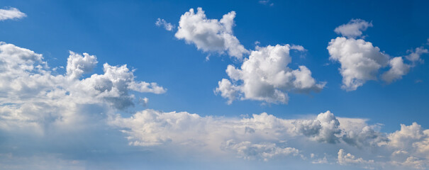 Canvas Print - white clouds in blue summer sky panoramic background