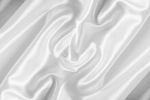Closeup Of Rippled White Silk Fabric. White Silk Fabric As An Abstract Background.
