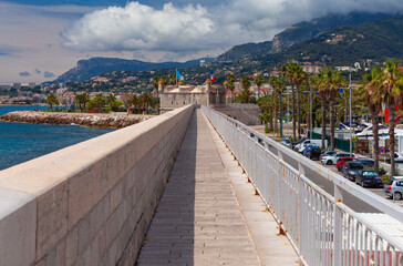 Wall Mural - Menton. Old bastion fort with a fortress wall on the seashore.