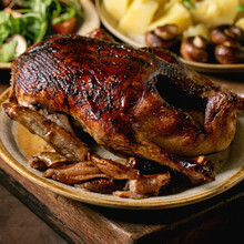 Classic Dish Roasted Glazed Duck With Apples And Garnish