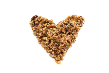 Wall Mural - A handful of walnuts in the shape of a heart. Isolated on white background. Nuts are available in two forms, shell or shelled, and can be whole, halved, or in smaller portions due to processing.