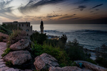 Twilight Colors The Sky Off The Coast Of Jaffa, Israel With A View Of A Mosque Minaret And The Mediterranean Sea.