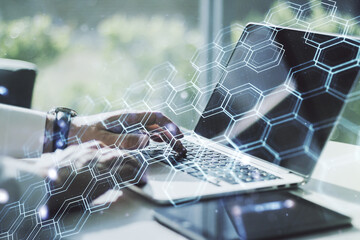 Aufkleber - Double exposure of technology hologram with hexagon and hands typing on laptop on background. Research and development software concept