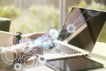 Aufkleber - Double exposure of robotics technology hologram and hands typing on laptop on background. Research and development software concept