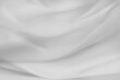 Close-up of rippled white silk fabric texture