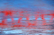 Abstract reflexion of a red bridge in the river
