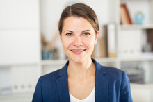 Closeup Portrait Of Successful Smiling Business Woman On Background Of Blurred Office Interior