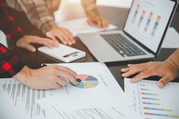 Businessmen together analyze charts and graphs. Team work to be successful. Business growth, business strategy.