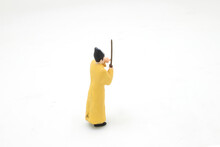 A Scale Of Mini Taoist Priest Figure On Board