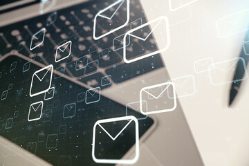 Poster - Double exposure of postal envelopes hologram on laptop background. Electronic mail and spam concept