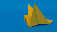 Bird Made From Folded Yellow Paper Against Blue Background. Origami Concept With Copy Space.