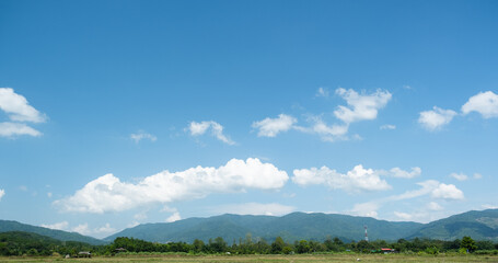 Wall Mural - The white clouds have a quaint and rural shape. The sky is cloudy and blue