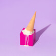 Summer creative layout with melting ice cream cone upside down on bright pink cube on pastel purple background. 80s or 90s retro fashion aesthetic ice cream concept. Minimal summer idea.