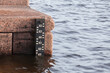 Tide gauge scale mounted on the Neva river bank