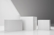 © YuliiaMazurkevych - Three white square stands on white background. 3d render