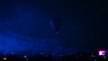 Hot Air Balloon Flying Over Spectacular Cappadocia Under The Sky With Milky Way And Shininng Star At Night (with Grain)
