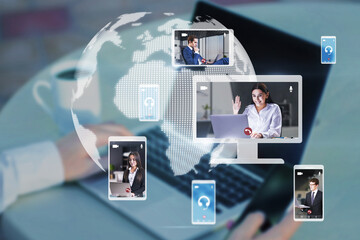 Poster - Close up of hands at workplace with devices and creative globe map with computer screens and creative video conference call between attractive young european businesspeople.